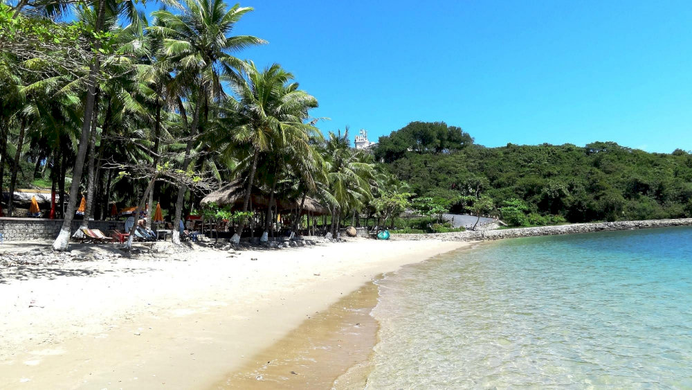 Visitors can soak up the sun and sea at Nha Trang Beach, where vibrant blue waters meet the laid-back charm of the coast